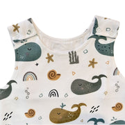 Harem Romper - Whales on White shoulder press studs and whale print neckline close-up