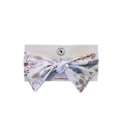 Babies headband in a Baba Fishees Finn and Friends print on a white cardboard with Baba Fishees logo