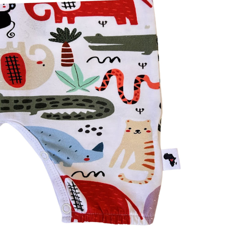 Henley Romper - Rust Ellie crotch press studs and colourful elephant, crocodile and tiger print close-up