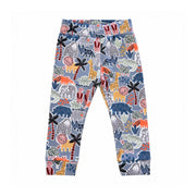 Front of blue-grey Meerkat Manor pull-on pants with a wide waistband and ankle cuffs, featuring pink meerkats, mustard giraffes and lions, green crocodiles and tortoises.