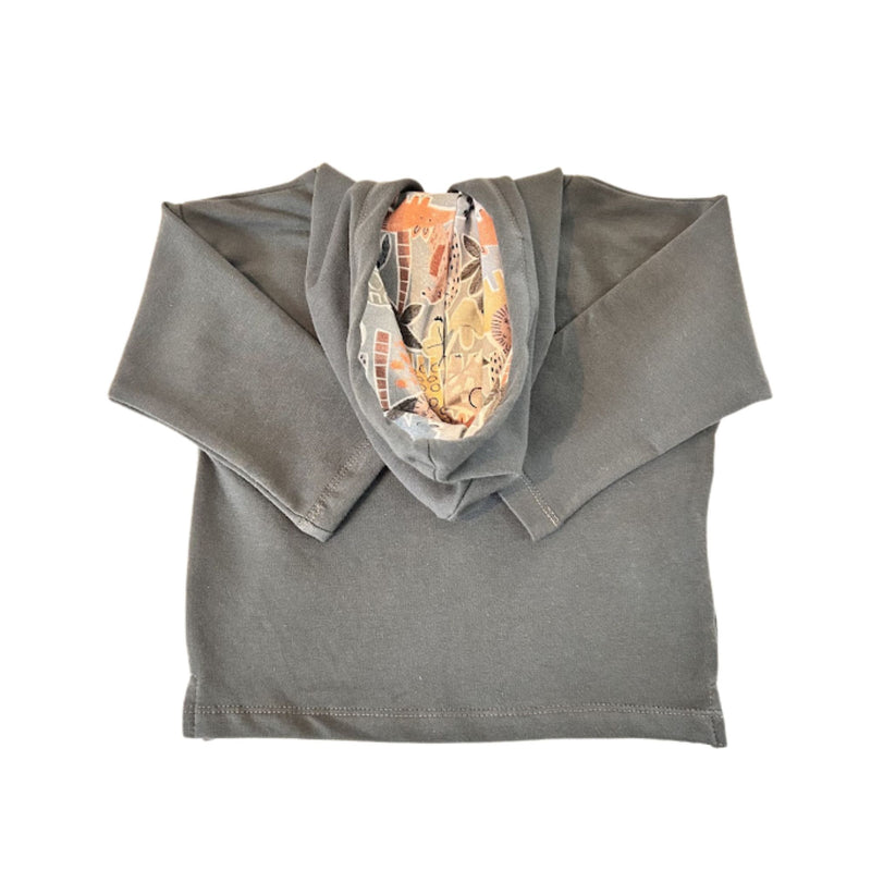 A folded airforce blue long-sleeve hoodie with the hood open, showing a colorful graphic print lining inside.