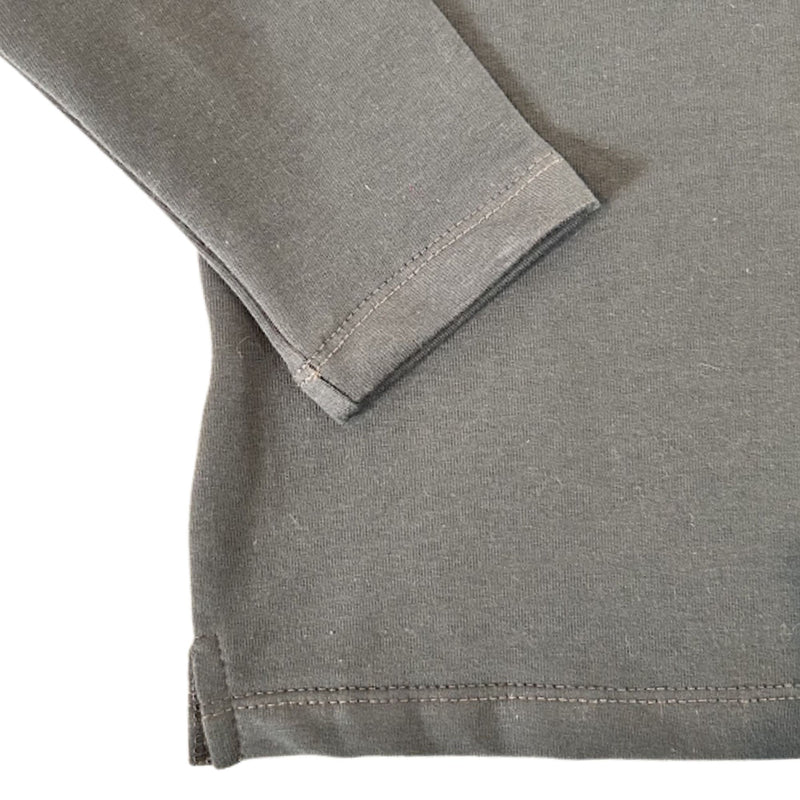 Close-up of an airforce blue long-sleeve hoodie showing the sleeve cuff and hem with fine stitching.