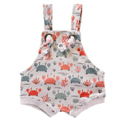 Knot Dungaree - Crab Gang in white background with pink and pale blue crabs print, sea-inspired details and knot shoulder straps