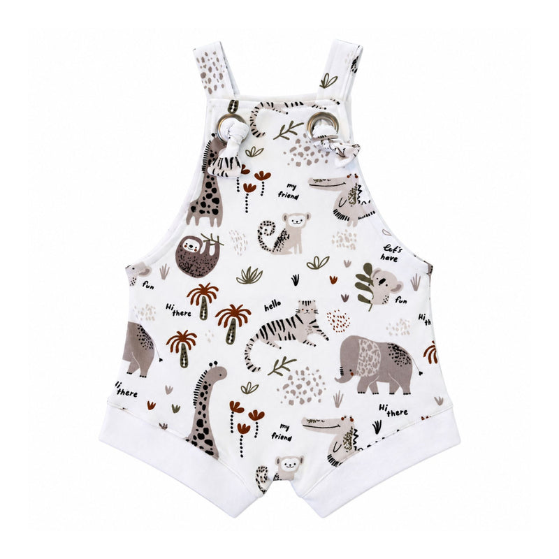 Knot Dungaree - Hi There White, front view with knotted straps through metal eyelets, white leg cuffs and beige animals among olive leaves and rust palms.