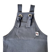 Close up of an Airforce Blue Knot Dungaree Long Leg with adjustable shoulder straps, metal grommets, and a small Baba Fishees label on the chest pocket.
