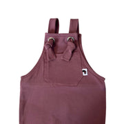 Closeup of A grape coloured knot dungaree long leg with adjustable shoulder straps and a front pocket with a small white Baba Fishees brand tag.