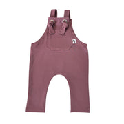 A grape coloured knot dungaree long leg with adjustable shoulder straps and a front pocket with a small white Baba Fishees brand tag.