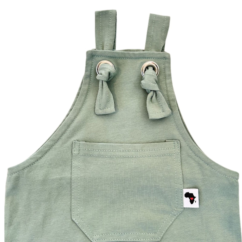 Neckline closeup view of  Knot Dungaree Long Leg in Mint Green with adjustable shoulder straps, metal grommets, and a small Baba Fishees label on the chest pocket.