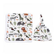 Matching Blanket & Beanie Set - African Plains displayed side by side, showing the blanket’s white binding and rounded corner, and the beanie’s knotted top and folded brim in matching animal print.