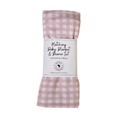 Folded baby blanket and knot beanie set in pink and white checked gingham
