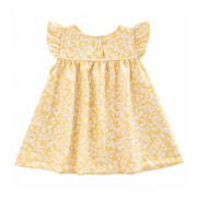 Back view of the pale yellow Mocca Dress with a white floral print, flutter sleeves, two white press studs and a gathered skirt.
