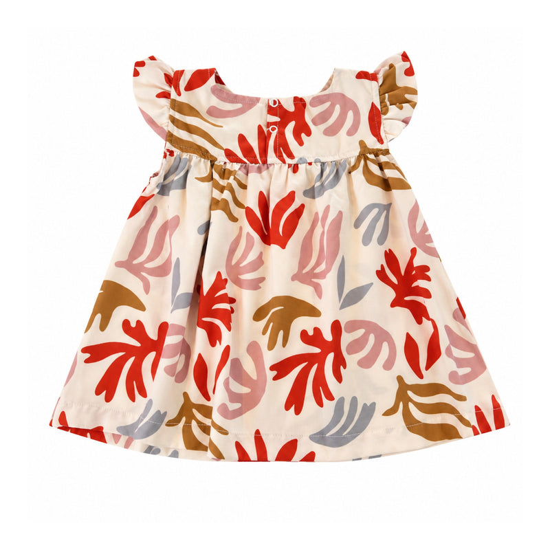 Back view of the cream Mocca Dress in the Matisse print, featuring abstract red, dusty pink, mustard and grey shapes, ruffled sleeves, a gathered skirt and two white press studs.