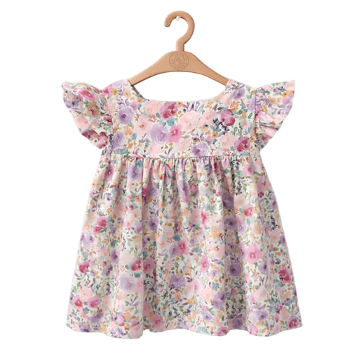 Floral dress on a wooden hanger against a white background