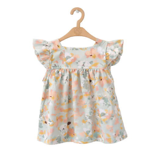 Floral-patterned dress on a wooden hanger against a white background