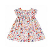 Back view of a white multicoloured floral dress with flutter sleeves, two white press studs at the neckline and a gathered skirt.