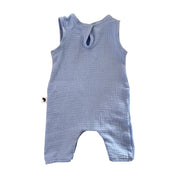 A sky blue textured cotton muslin baby romper with a back tie detail, shown flat on a white background.