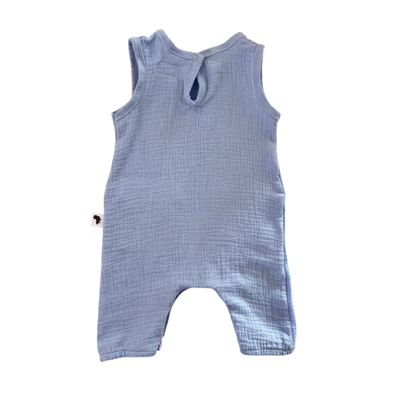 A sky blue textured cotton muslin baby romper with a back tie detail, shown flat on a white background.