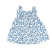 A ruffled dress with a white background and little light blue bluebells printed all over.