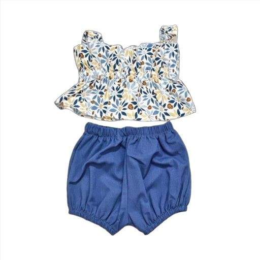 A shorts and top set with blue shorts and a ruffle sleeve design and flower wheels.