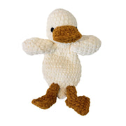 A crocheted plush duck toy with a textured cream body, a mustard yellow beak, and mustard yellow webbed feet.