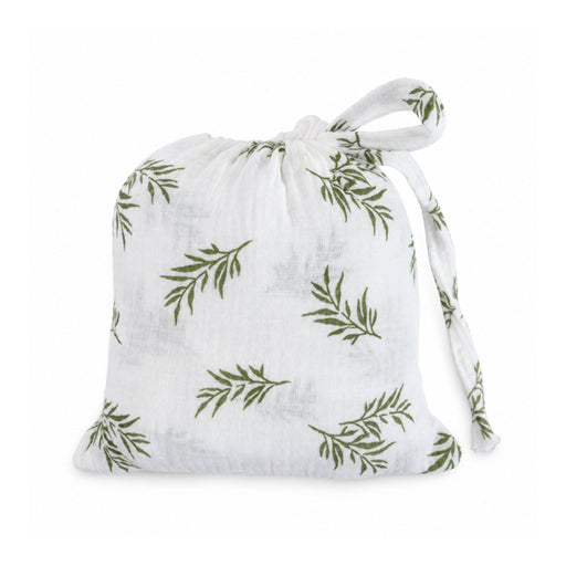 Swaddle Blanket - Wild Olive presented in a matching white muslin drawstring bag with olive-green botanical branches and fabric ties