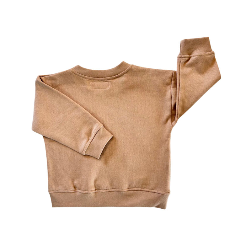 Back view of a caramel-coloured  crewneck sweatshirt with long sleeves and ribbed cuffs and hem.