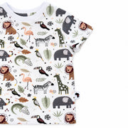Cropped side detail of Tee Shirt - African Plains showing the short sleeve, stitched bottom hem and Africa-shaped side label beside the colourful animal print.