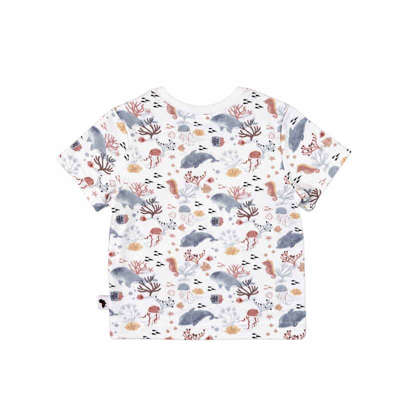 Back view of A short-sleeve children's t-shirt with an all-over whimsical print of sea creatures, including dolphins, seahorses, starfish, and coral, on a white background. 