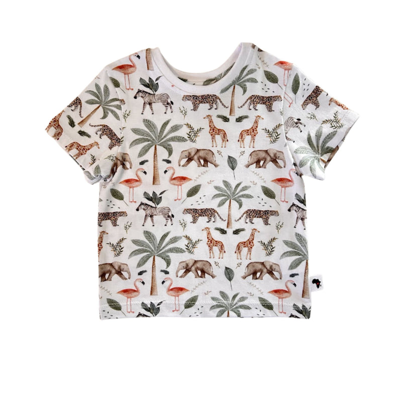 Front view of white Tee Shirt – Two By Two with short sleeves, a white ribbed neckline and an all-over giraffe, elephant, flamingo, zebra, leopard and palm-tree print