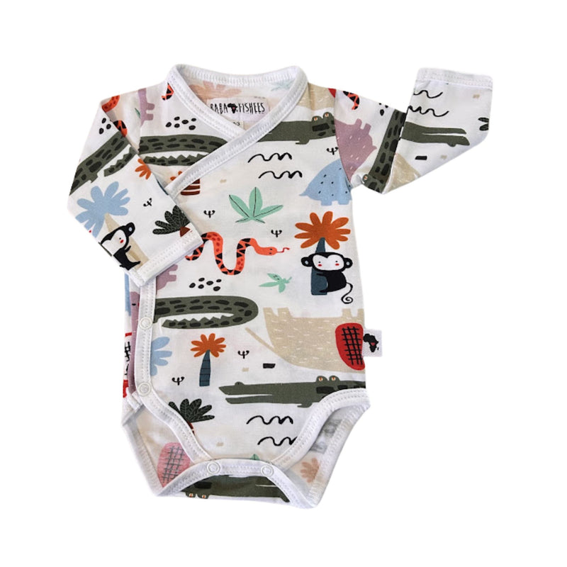 A long-sleeve baby wrap onesie bodysuit with an all-over safari-themed print on a white background. The print features illustrations of [alm trees, a snake, a monkey, a bird, and abstract shapes in muted green, orange, blue, and black.