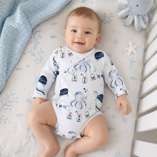 Baby wearing wrap onesie - long sleeved lying n cot