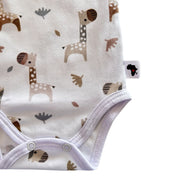 Bottom close-up of Wrap Onesie - Short Sleeve - Kameelperd showing two crotch press studs, bound leg openings and Baba Fishees Africa side label