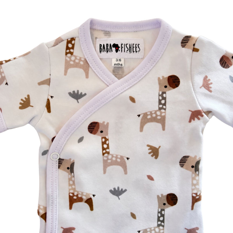 Neckline close-up of Wrap Onesie - Short Sleeve - Kameelperd showing the bound crossover neck, Baba Fishees label and upper press-stud fastening