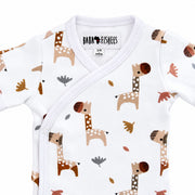 Neckline close-up of Wrap Onesie - Short Sleeve - Kameelperd showing the bound crossover neck, Baba Fishees label and upper press-stud fastening