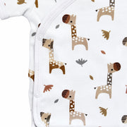 Side close-up of Wrap Onesie - Short Sleeve - Kameelperd showing the row of three press studs, neat white binding and detailed giraffe illustrations