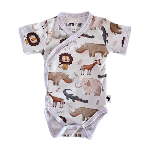 A short-sleeve baby bodysuit with an all-over safari animal print, featuring a white base with illustrations of a lion, elephant, rhinoceros, giraffe, crocodile, and hippo in earthy brown, beige, and gray tones. The brand 'Baba Fishees' is visible on the inner neck label.