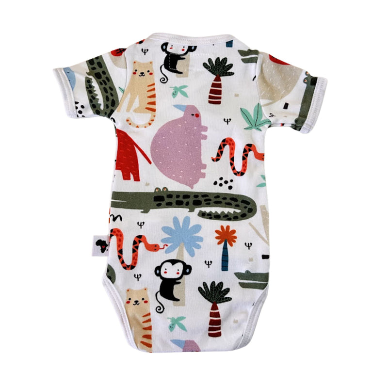 Back view of a white short-sleeve baby wrap onesie bodysuit featuring a colorful cartoon animal and plant print, including monkeys, crocodiles, snakes, and palm trees.