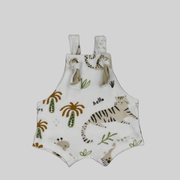 Short knot dungarees with our hi there white print of animals and palm trees with the words hello.